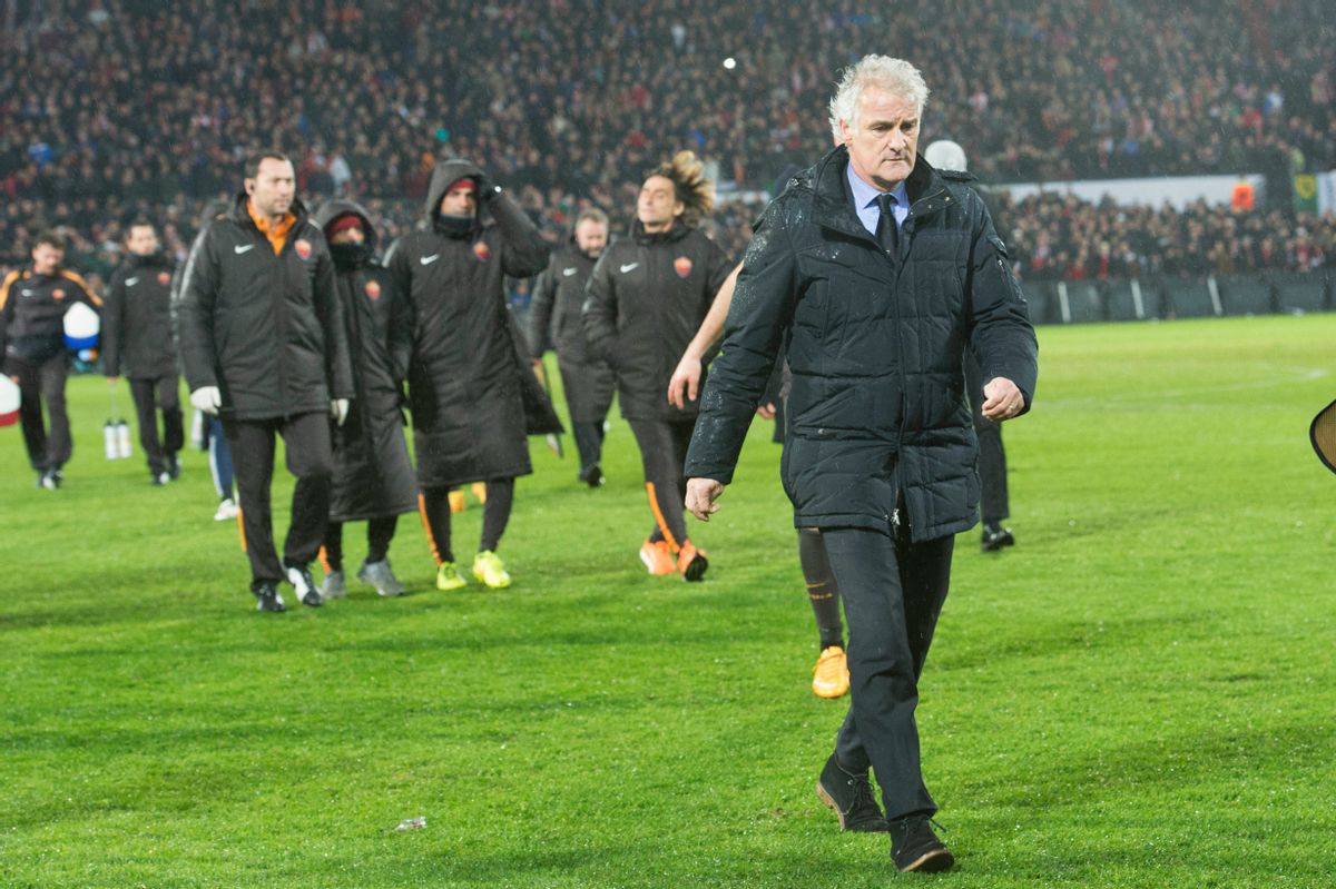 PSV head coach Fred Tutten leaves the pitch after Referee Clement Cano from France ceased  an Europa  League round of 32 second leg soccer match between Feyenoord and AS Roma, at De Kuip stadium in Rotterdam, Netherlands, Thursday Feb. 26, 2015. (AP Photo/Ermindo Armino) (AP)