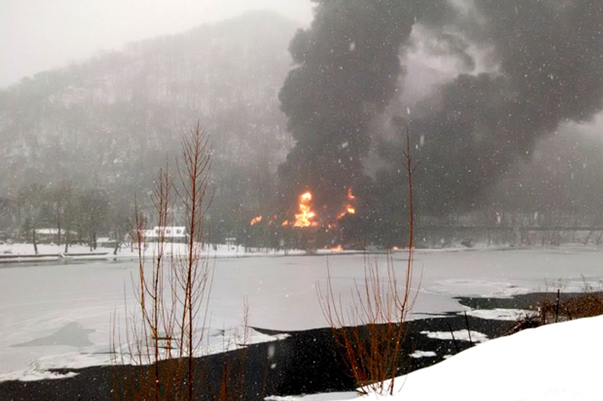Fire burns at the scene of a train derailment, near Mount Carbon, W.Va, Feb. 16, 2015.   (AP/Bob Aaron)