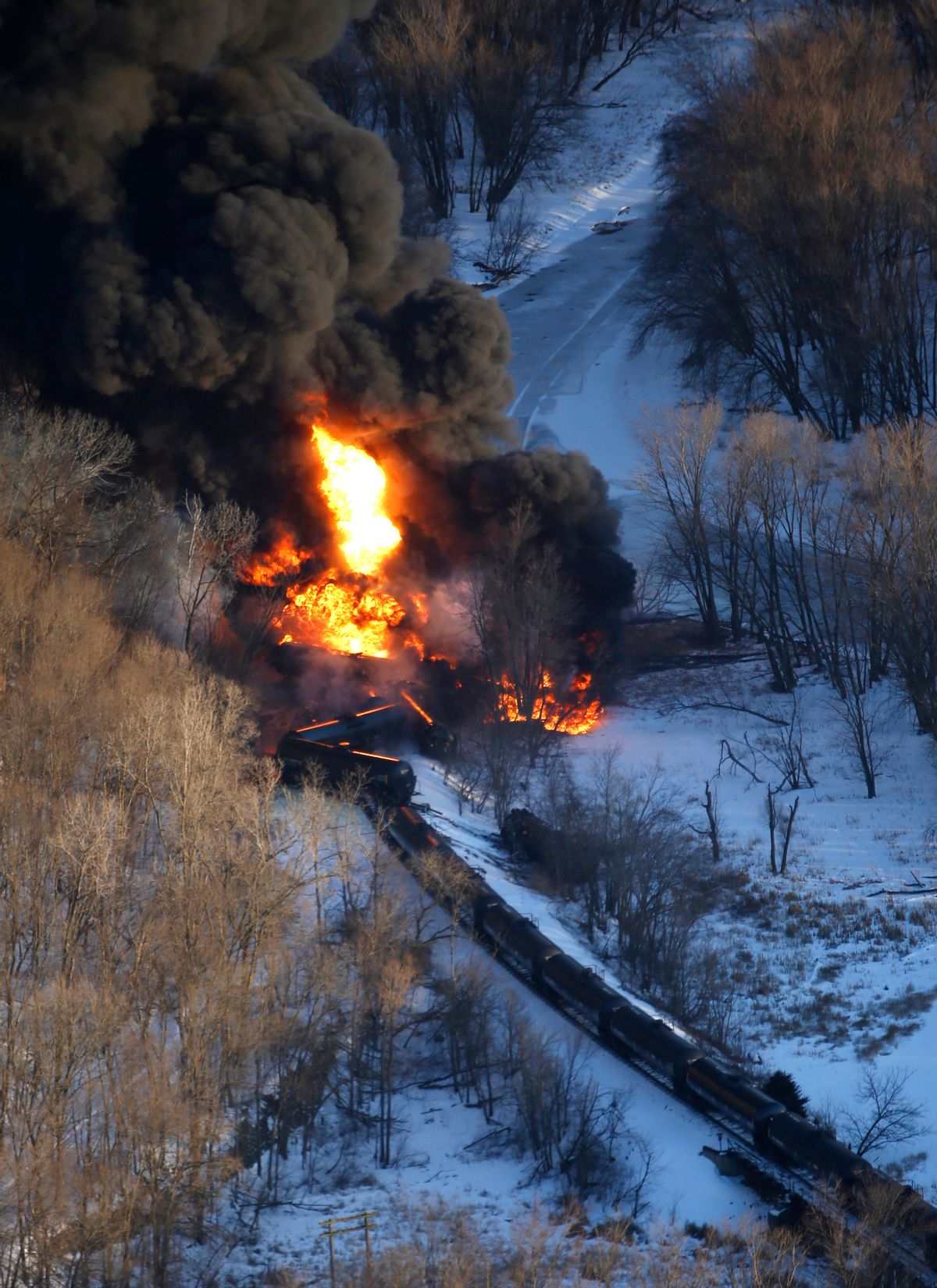 Smoke and flames erupt from the scene of a train derailment Thursday, March 5, 2015, near Galena, Ill. A BNSF Railway freight train loaded with crude oil derailed around 1:20 p.m. in a rural area where the Galena River meets the Mississippi, said Jo Daviess County Sheriff's Sgt. Mike Moser. (AP Photo/Telegraph Herald, Mike Burley)  (AP)