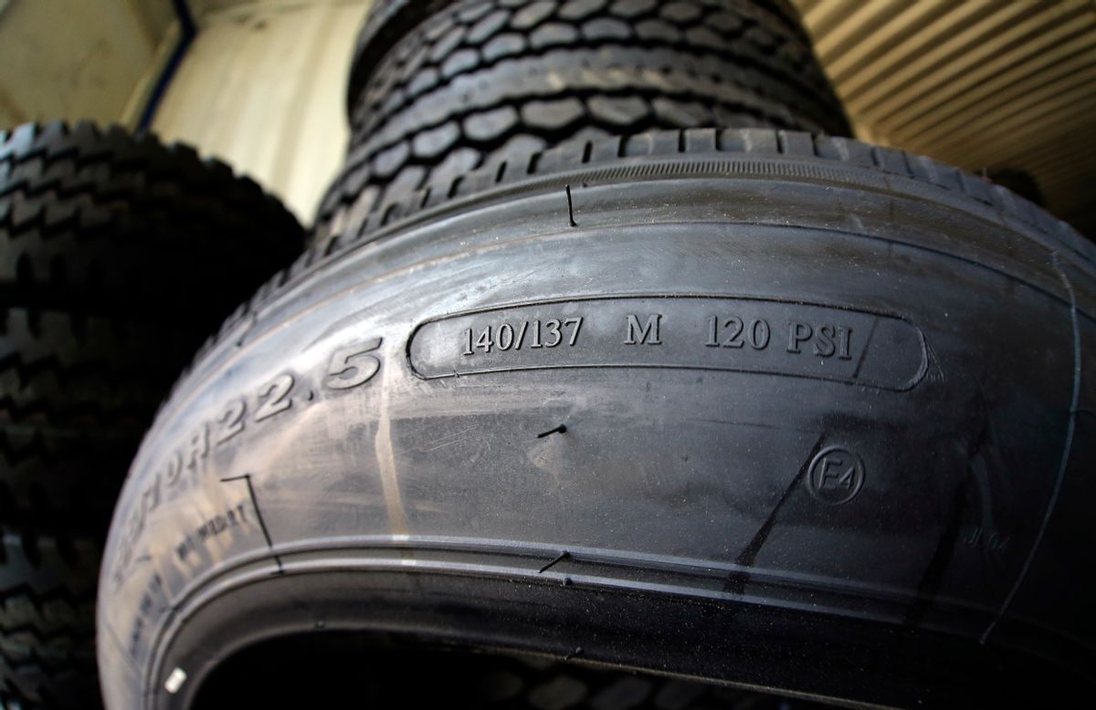 This March 18, 2015 photo shows the load index, 140/137, and speed rating, M, on a popular size semi-tractor trailer tire, at a truck tire shop in Houston. The M speed rating indicates that 81 mph is the maximum speed at which this tire can carry a load weighing 5,512 pounds at the recommended air pressure. (AP Photo/David J. Phillip) (AP Photo/David J. Phillip)