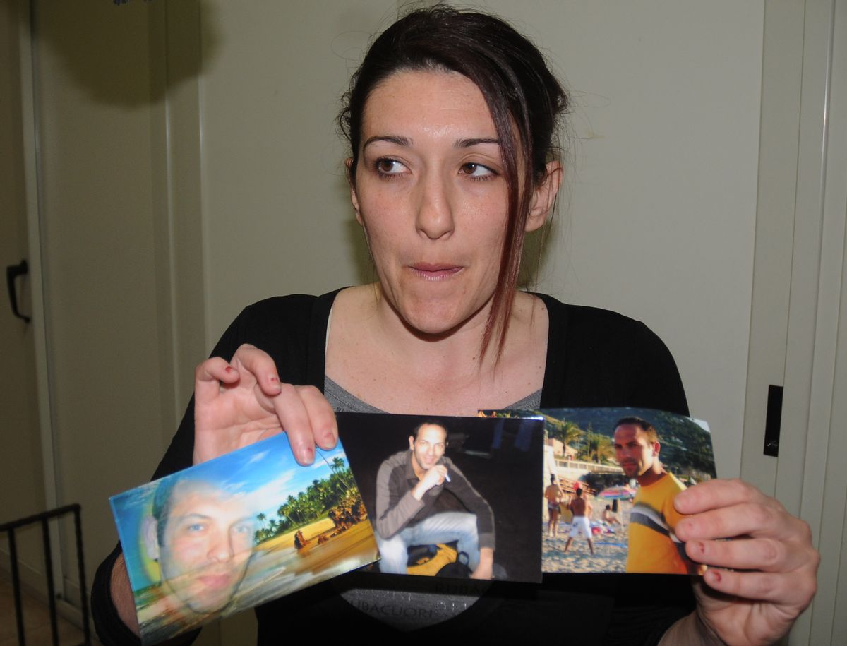 Giovanna Piazza, Italian aid worker Giovanni Lo Porto's sister-in-law, shows Giovanni Lo Porto's pictures to the photographer in Palermo, Sicily, Italy, Thursday, April 23, 2015. The Italian government on Thursday deplored the death of an Italian aid worker in a U.S. air strike, calling it a "fatal error" by the Americans. Italian Premier Matteo Renzi expressed his "profound pain" over Giovanni Lo Porto's death and offered Italy's condolences to Lo Porto's family and that of American Warren Weinstein, who was killed in the same airstrike on the border between Pakistan and Afghanistan. Both were held hostage by al-Qaida. (AP Photo/Alessandro Fucarini) (AP)
