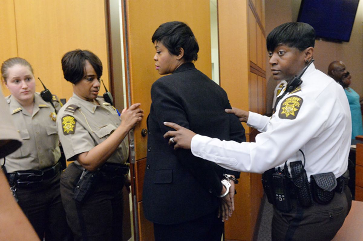 Former Deerwood Academy assistant principal Tabeeka Jordan is led to a holding cell after a jury found her guilty, April 1, 2015, in Atlanta.    (AP/Kent D. Johnson)