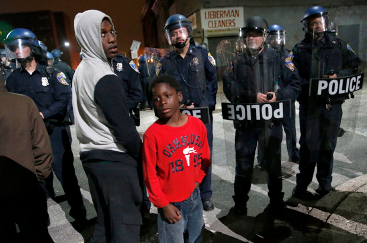 Police stand guard as protesters gather for a rally, Maryland April 25, 2015.        (Reuters/Shannon Stapleton)