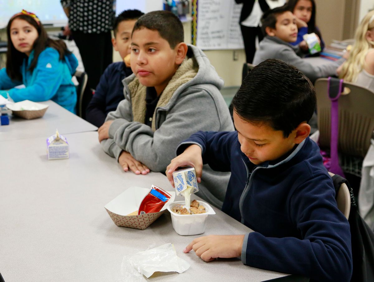 In this Wednesday, April 8, 2015 photo, students are served breakfast at the Stanley Mosk Elementary School in Los Angeles. In this Los Angeles Unified School District program, and in other major urban school districts, breakfast is increasingly being served inside the classroom. The number of breakfasts served in the nations schools has doubled in the last two decades, a surge driven largely by a change in how districts deliver the food. Instead of providing low-income students free or reduced-price meals in the cafeteria, theyre increasingly serving all children in the classroom. (AP Photo/Nick Ut) (AP)