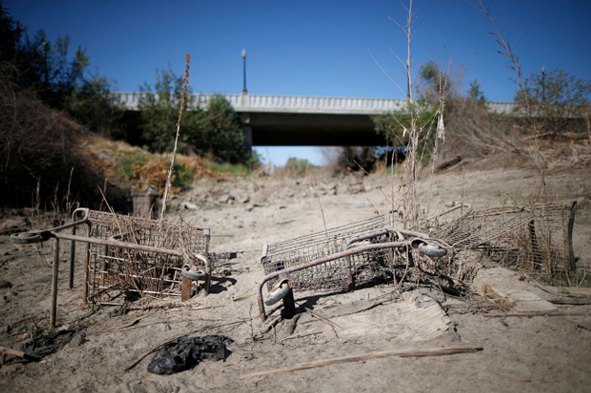 Discarded shopping carts lie in the dry Tule riverbed in Porterville, California, October 14, 2014.        (Reuters/Lucy Nicholson)