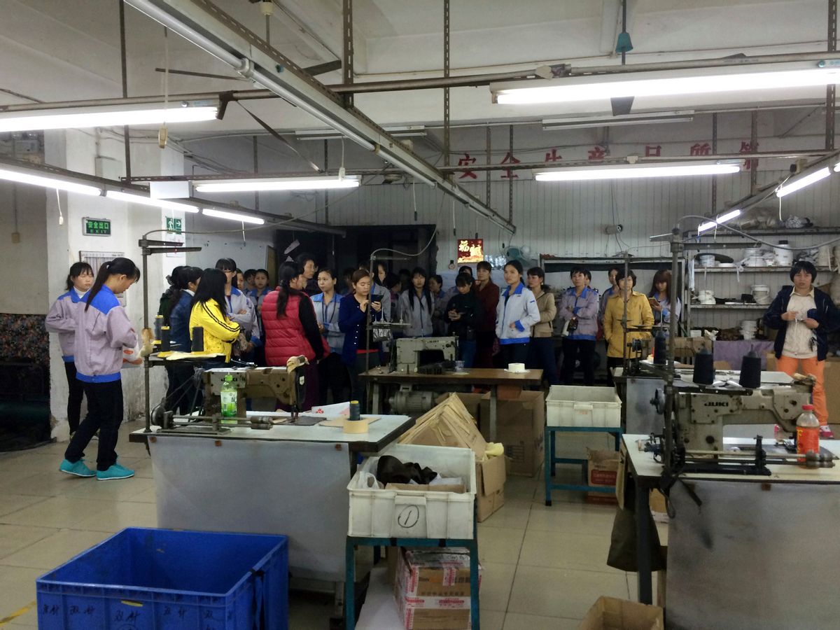 HOLD FOR STORY CHINA LABOR MOVEMENT In this March 26, 2015 photo, workers gather at one end of the factory floor as they strike at the Cuiheng Handbag Factory in Nanlang township in Zhongshan city in southern China's Guangdong Province. More than three decades after Beijing began economic reforms that let a market economy take root, the 168 million-strong force of Chinaâs migrant workers _ who have left rice paddies and cornfields behind for factory and service jobs in bustling industrial cities _ are increasingly demanding their rights and a fair share of proceeds from the countryâs now-slowing economic boom. (AP Photo/Didi Tang) (Didi Tang)