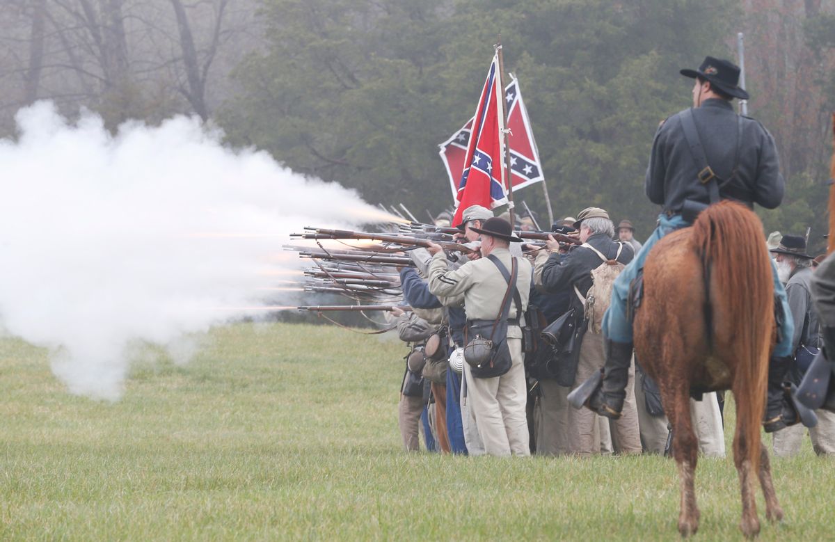 Confederate troops fire muskets at Union troops during a re-enactment of the Battle of Appomattox Courthouse as part of the commemoration of the 150th anniversary of the surrender of the Army of Northern Virginia at Appomattox Court House in Appomattox, Va., Thursday, April 9, 2015.  The battle was the final battle of the army of Confederate General Robert E. Lee before his surrender to Union troops.  (AP Photo/Steve Helber) (AP)