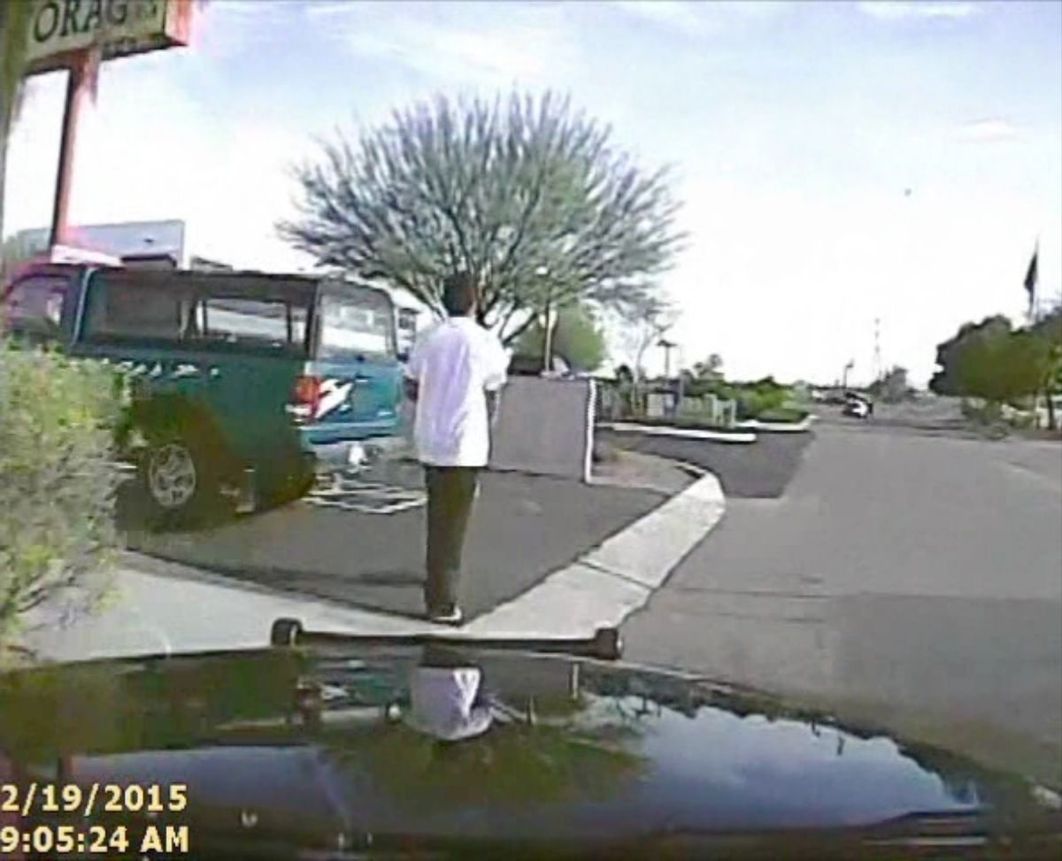 In this Feb. 19, 2015, frame from a dash cam video provided by the Marana Police Department, a police vehicle nears Mario Valencia in Marana, Ariz. Dramatic dash cam video released Tuesday, April 14 shows a police officer using his cruiser to ram the armed suspect, Valencia, sending him flying in the air before the car smashes into a wall. Valencia survived the crash, and prosecutors cleared the officer of any wrongdoing. (Marana Police Department via AP) (AP)