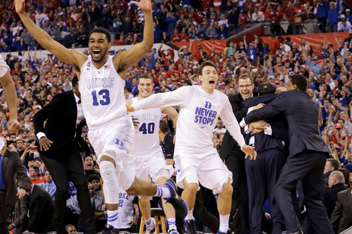 Duke players celebrate after the NCAA college basketball tournament championship game against Wisconsin, April 6, 2015, in Indianapolis.    (AP/David J. Phillip)