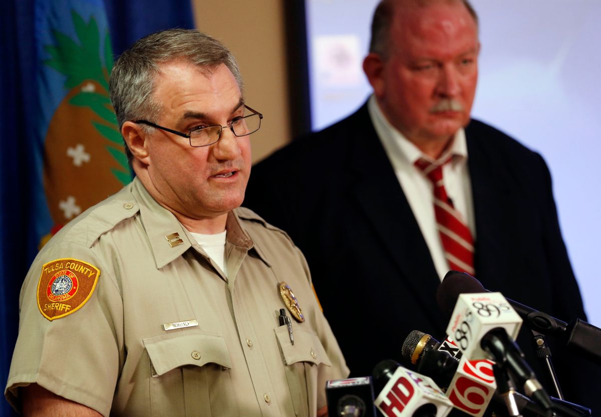 In this Friday, April 10, 2015, photo, Tulsa County Sheriff's Office Capt. Billy McKelvey, left, speaks next to Jim Clark, an independent consultant, during a news conference about the investigation of the death of Eric Harris in Tulsa, Okla. Police say a reserve sheriff's deputy thought he was holding a stun gun, not his handgun, when he fatally shot Harris during an arrest that was caught on video in Tulsa. (Cory Young/Tulsa World via AP) (AP)