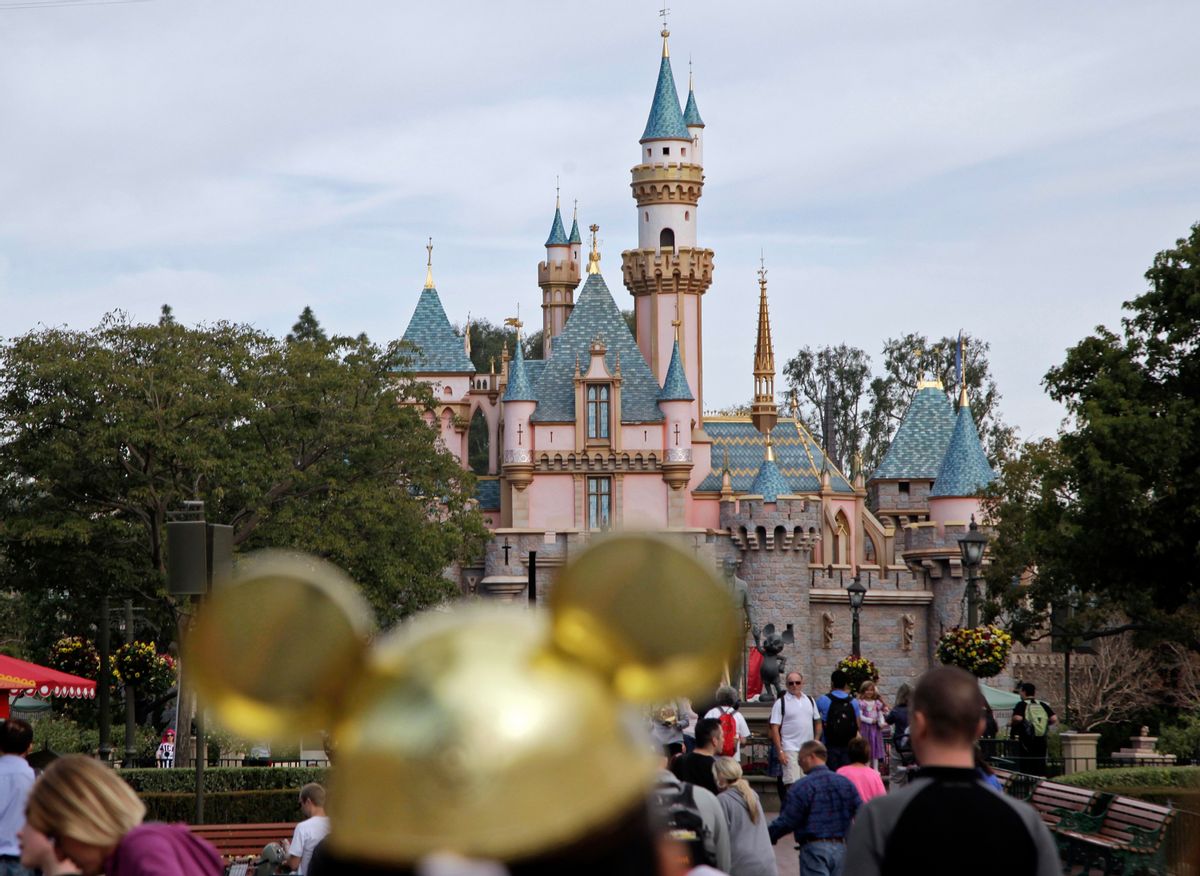FILE - In this Jan. 22, 2015, file photo, people walk toward Sleeping Beauty's Castle at Disneyland in Anaheim, Calif. A measles outbreak that began at Disneyland and reignited debate about vaccinations is nearing an end. The outbreak will be declared over in California on Friday, April 17, 2015, if no new cases pop up, according to the California Department of Public Health. (AP Photo/Jae C. Hong, File) (AP)