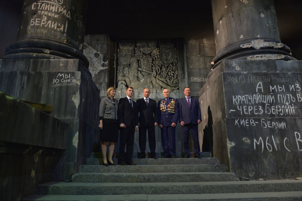 Russian President Vladimir Putin, center, poses for a photograph as he visits a diorama representing the storming of Berlin by the Soviet army in the closing days of World War II in the 1945 battle for Berlin in St. Petersburg, Russia Tuesday, April 28, 2015. (Alexei Druzhinin/RIA Novosti, Kremlin Pool Photo via AP) (AP)
