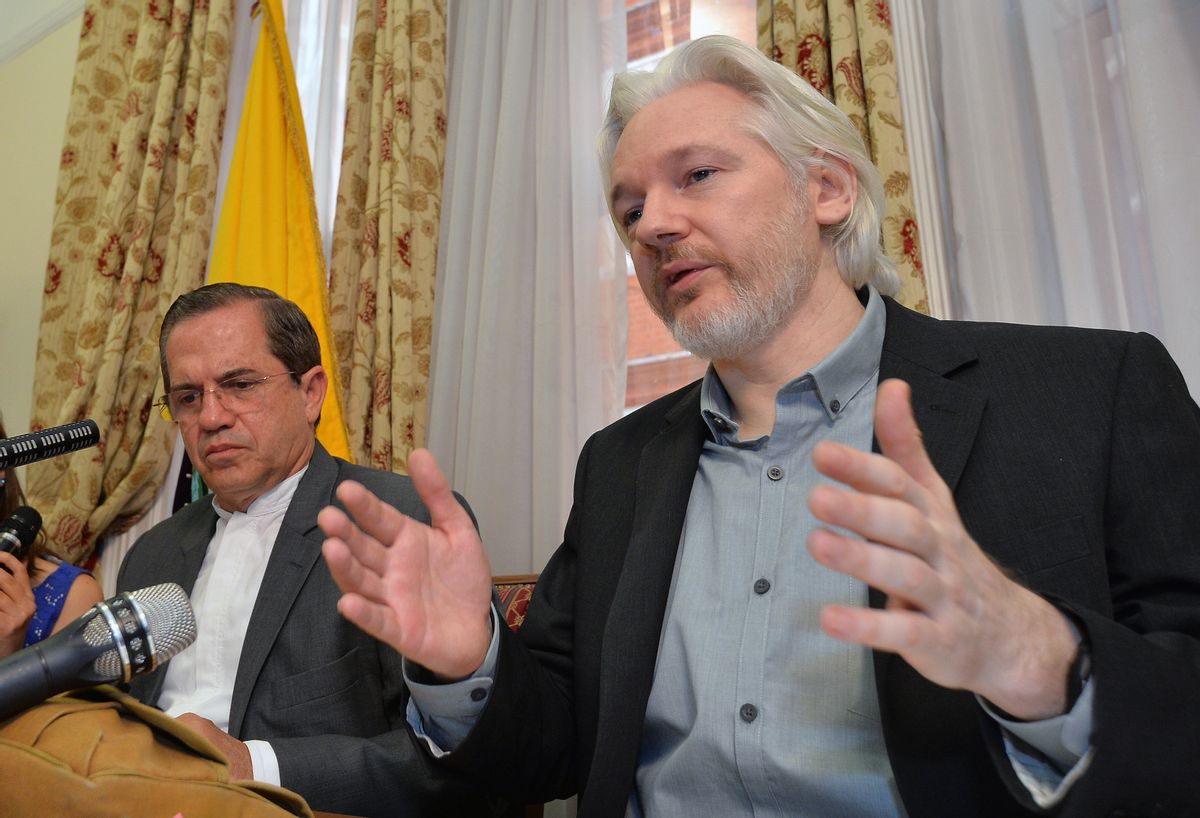 FILE - In this Aug. 18, 2014, file photo, Ecuador's Foreign Minister Ricardo Patino, left, and WikiLeaks founder Julian Assange speak during a news conference inside the Ecuadorian Embassy in London.  (AP)