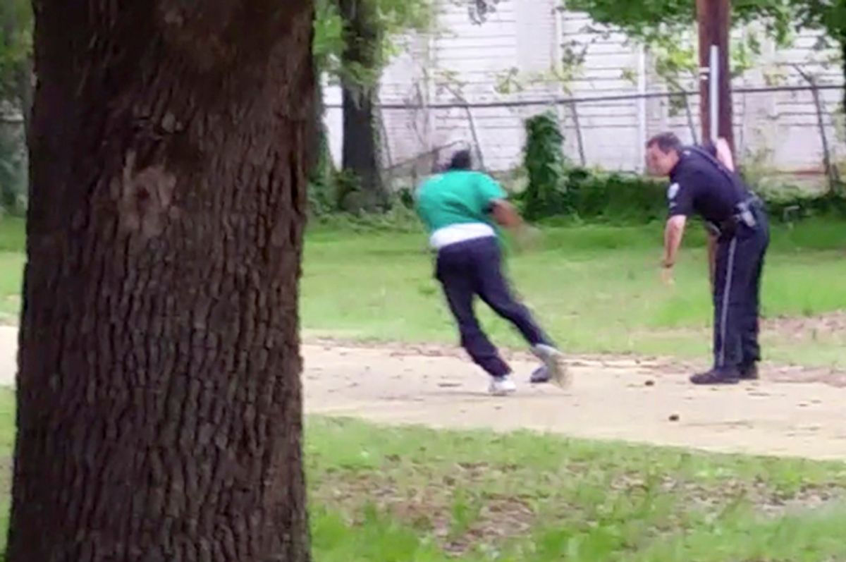Michael Thomas Slager, right, pulls out his handgun as Walter Scott runs away from him, April 4, 2015, in North Charleston, S.C.         (AP/Courtesy of L. Chris Stewart)