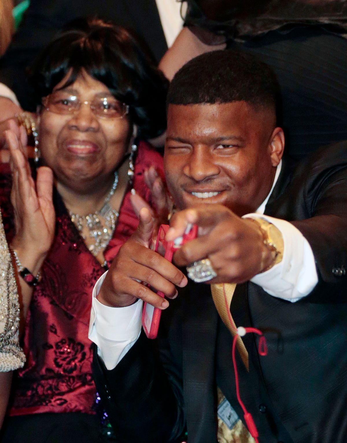 Jameis Winston reacts to the announcement with his Grandmother, Myrtle Winston, watching as the Tampa Bay Buccaneers select him as the number one draft pick in the 2015 NFL Draft, Thursday, April 30, 2015, in Bessemer, Ala. (AP Photo/Butch Dill)  (AP)