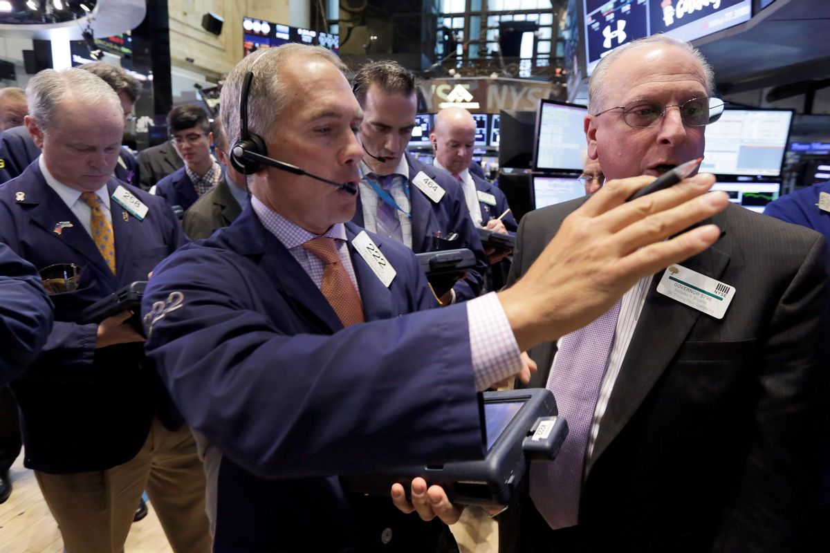 Trader Timothy Nick, center, works on the floor of the New York Stock Exchange, Tuesday, May 12, 2015. U.S. stocks are opening lower following declines in European markets. (AP Photo/Richard Drew) (AP)