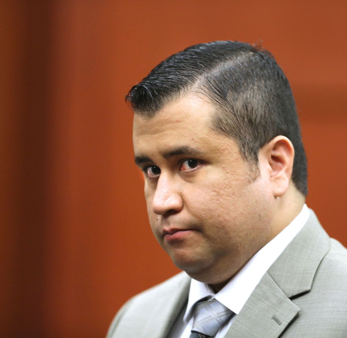 FILE - In this July 9, 2013 file photo, George Zimmerman leaves the courtroom for a lunch break his trial in Seminole Circuit Court, in Sanford, Fla. A police report says a man charged with shooting at George Zimmerman on May 11, 2015, had a fixation on the former neighborhood watch leader. The report made public Tuesday, May 19, 2015,  says 36-year-old Matthew Apperson had recently been admitted to a mental institution and had shown signs of paranoia, anxiety and bipolar disorder. (AP Photo/Orlando Sentinel, Joe Burbank, Pool, File via AP) (AP)