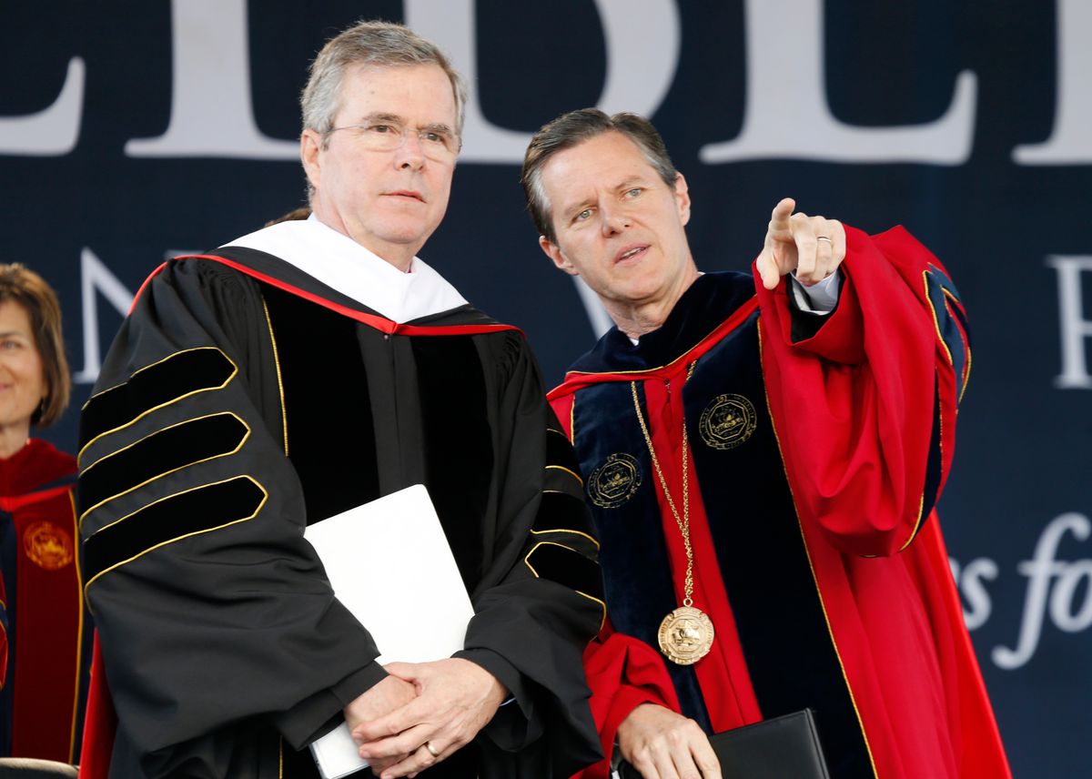 Commencement speaker former Florida Gov. Jeb Bush, left, arrives on stage with Liberty University president, Jerry Falwell Jr., for commencement ceremonies in Williams Stadium at the school in Lynchburg, Va., Saturday, May 9, 2015.   (AP Photo/Steve Helber) (AP)
