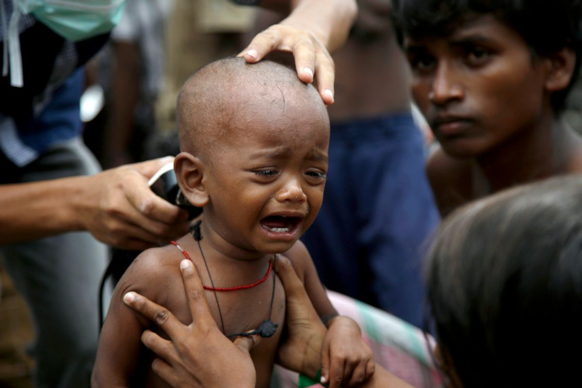 An ethnic Rohingya kid cries after receives a free haircut service provided by a local charity at  temporary shelter in Langsa, Aceh province, Indonesia, Friday, May 22, 2015.Thousands of refugees and migrants have washed ashore in Malaysia, Indonesia and Thailand, about half Rohingya and the rest from Bangladesh, according to the International Organization for Migration. The U.N. refugee agency estimates more than 3,000 others may still be at sea.(AP Photo/Tatan Syuflana) (Tatan Syuflana)