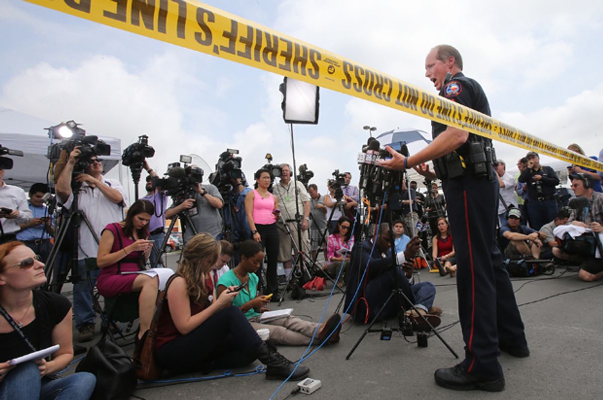 Waco Police Sgt. Patrick Swanton addresses the media as law enforcement continues to investigate the motorcycle gang related shooting at the Twin Peaks restaurant, Monday, May 18, 2015, in Waco, Texas.    (AP/Jerry Larson)