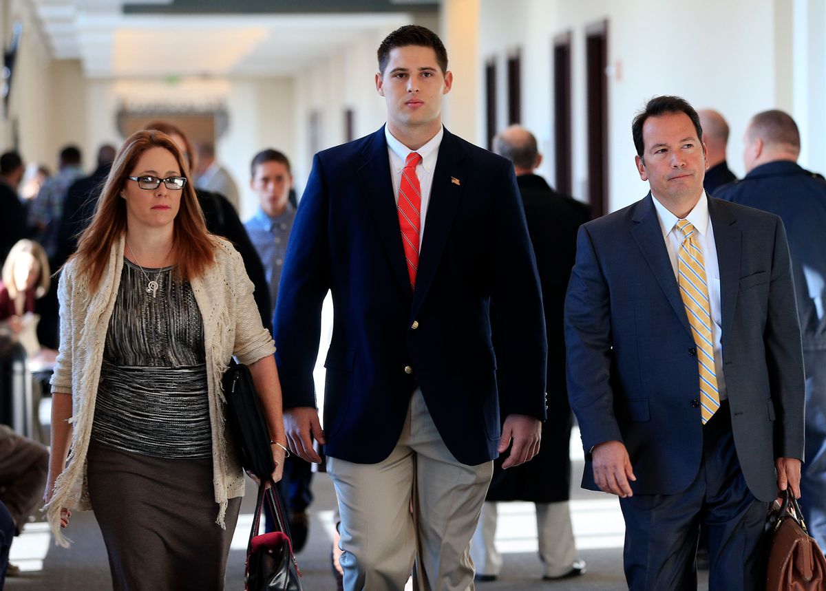 Former Vanderbilt University football player Brandon Vandenburg, center, arrives for jury selection in his trial Monday, Nov. 3, 2014, in Nashville, Tenn. Vandenburg and former teammate Cory Batey are charged with the rape of an unconscious 21-year-old female student on June 23, 2013. (AP Photo/Mark Humphrey)    (AP/Mark Humphrey)