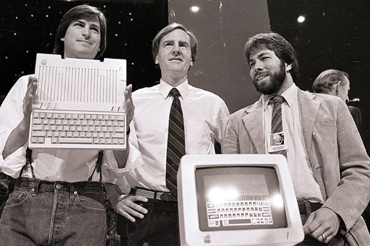Steve Jobs, John Sculley, and Steve Wozniak unveil the later Apple IIc computer, April 24, 1984.          (AP/Sal Veder)