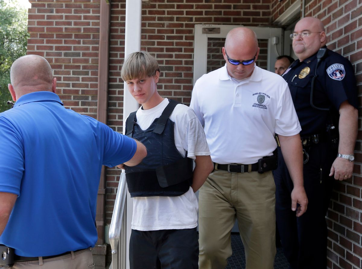 Charleston, S.C., shooting suspect Dylann Storm Roof, center, is escorted from the Shelby Police Department in Shelby, N.C., Thursday, June 18, 2015. Roof is a suspect in the shooting of several people Wednesday night at the historic The Emanuel African Methodist Episcopal Church in Charleston, S.C. (AP Photo/Chuck Burton)  (AP)