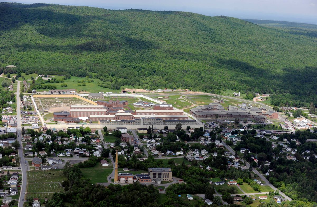 This aerial photo shows the Clinton Correctional Facility on Thursday, June 11, 2015 in Dannemora, N.Y. Police continue to search for David Sweat, 34, and Richard Matt, 48, two escaped inmates from the correctional facility.  In a renewed burst of activity near the prison, police using dogs and helicopters blocked off a main road and concentrated their sixth day of searching Thursday on a swampy area just a couple of miles from the institution, situated about 20 miles (30 kilometers) from the Canadian border. (AP Photo/Tim Roske) (AP)