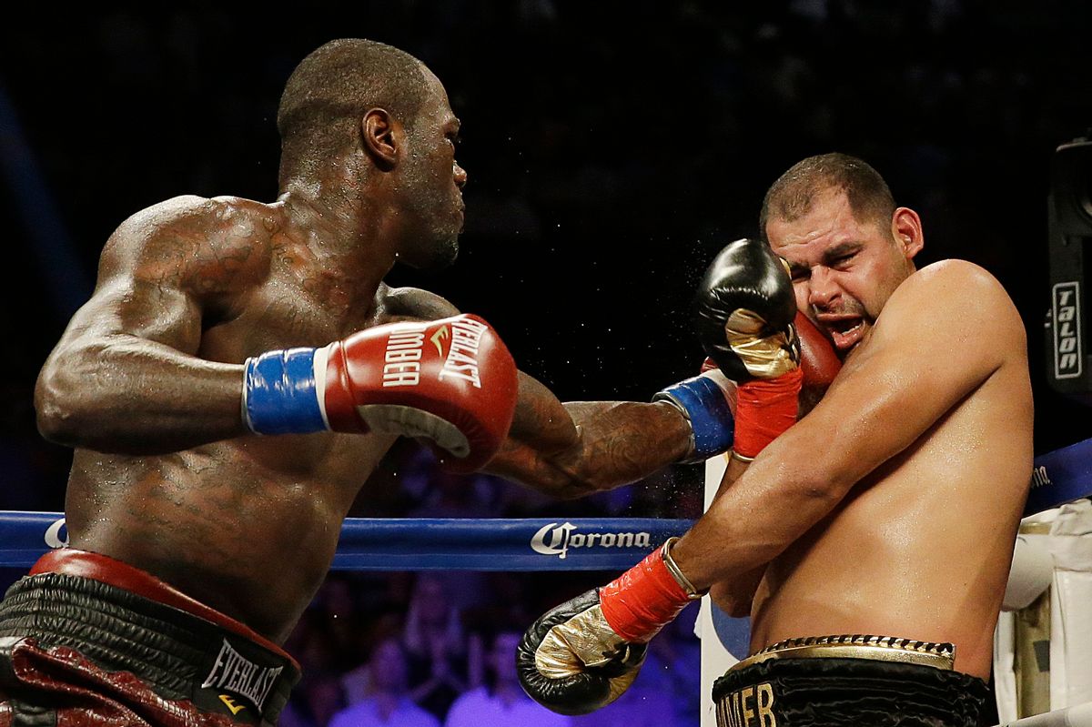 Deontay Wilder punches Eric Molina during the WBC heavyweight boxing match, Saturday, June 13, 2015, in Birmingham, Ala. (AP Photo/Brynn Anderson) (AP)