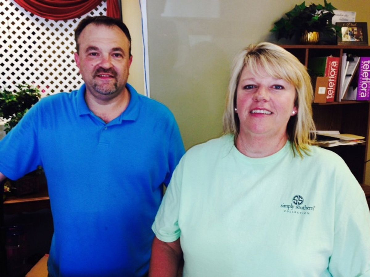 Todd Frady, left, and Debbie Dills of Frady's Florist in Kings Mountain, N.C., pose for a photo Thursday, June 18, 2015, after Dills called in the tip that ultimately led to the arrest of Dylann Storm Roof, the white man who police say killed people at a prayer meeting Wednesday at a black church in Charleston, S.C. Dills says she called Frady when she saw Roof driving, and Frady called a police officer he knew. (AP Photo/Steve Reed) (AP)