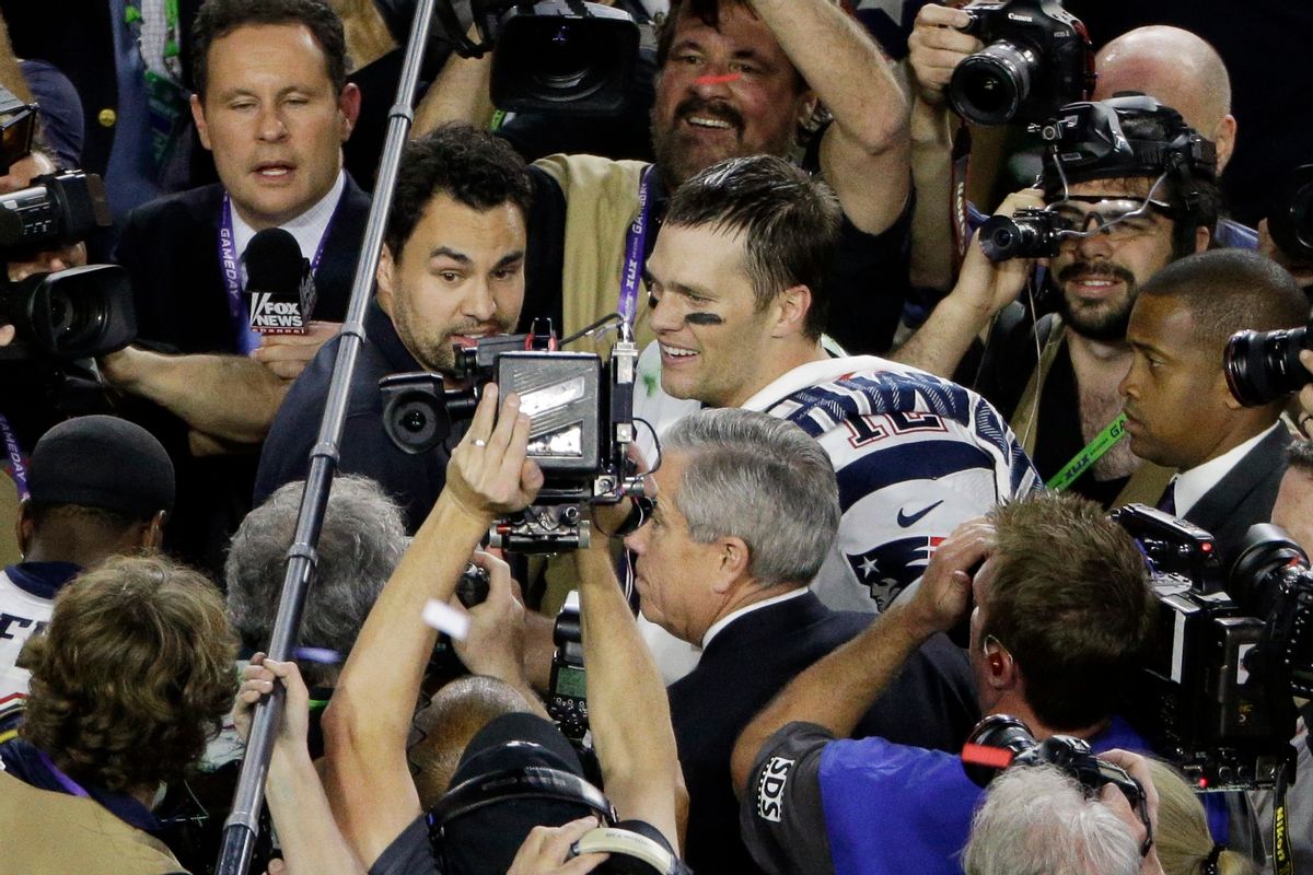 FILE - In this Feb. 1, 2015, file photo, New England Patriots quarterback Tom Brady (12) walks through a crowd of media after the NFL Super Bowl XLIX football game against the Seattle Seahawks in Glendale, Ariz. Men are behind more news stories than women by a nearly 2-to-1 margin across print and television platforms, though there was a slight increase in bylines and credits for women last year, a new study says. The Washington-based Women's Media Center released its study Thursday, June 4, 2015, as part of its fourth annual report on "The Status of Women in U.S. Media." (AP Photo/Charlie Riedel, File) (AP)