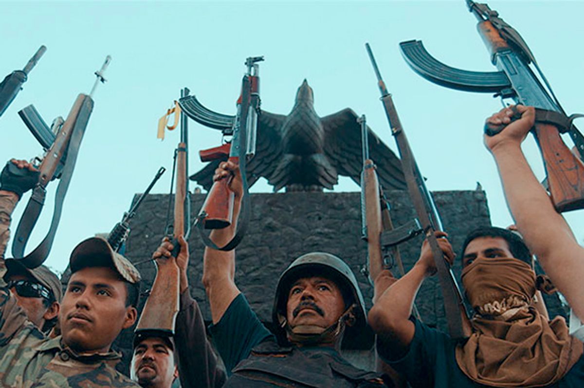 Vigilantes of the Autodefensa movement celebrate the "liberation" of a town in the Mexican state of Michoacán, in a scene from "Cartel Land." 