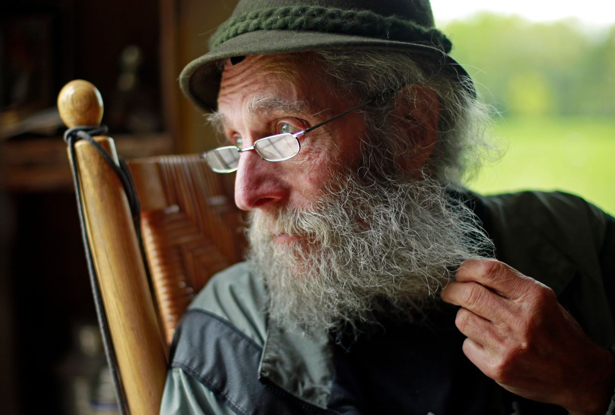 FILE- In May 23, 2014, file photo, Burt Shavitz pauses during an interview to watch a litter of fox kits play near his camp in Parkman, Maine. Shavitz, a former beekeeper, is the Burt behind Burt's Bees. A spokeswoman for Burts Bees said Shavtiz died Sunday, July 5, 2015, at his home in rural Maine. He was 80. (AP Photo/Robert F. Bukaty, File) (AP)