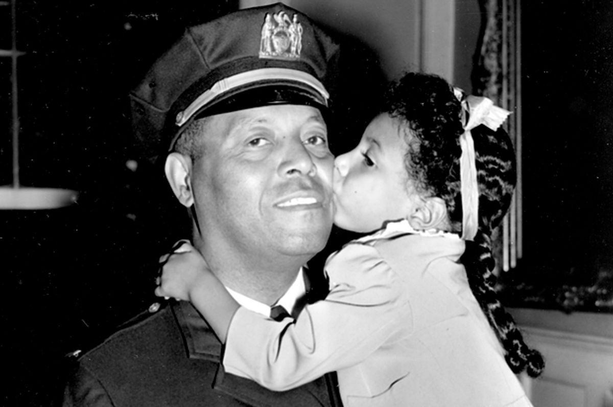 Lt. Samuel Battle gets a kiss from his granddaughter Yvonne, at City Hall in New York, Sept. 4, 1941.      (AP)