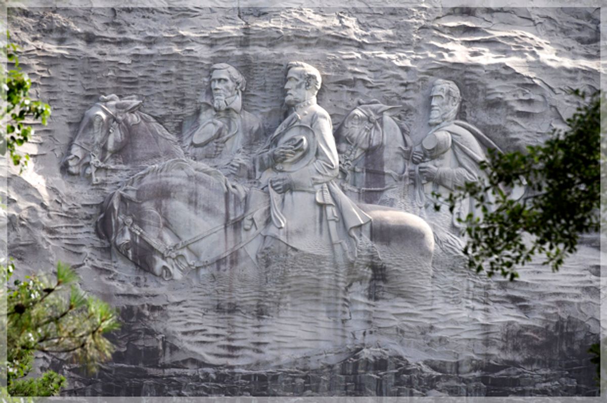 The carving depicting Stonewall Jackson, Robert E. Lee and Jefferson Davis, in Stone Mountain, Ga.       (AP/John Bazemore)
