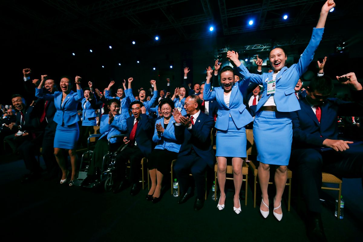 Members from the delegation from Beijing 2022 Winter Olympics candidate city reacts after the city was elected to host the 2022 Olympic Winter Games at IOC meeting in Kuala Lumpur, Malaysia, Friday, July 31, 2015. (AP Photo/Vincent Thian, Pool) (Vincent Thian)