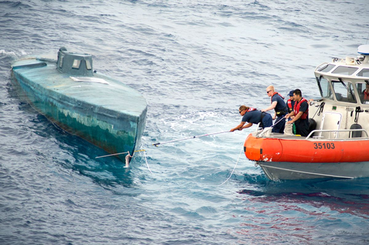 Crew from the U.S. Coast Guard Cutter Stratton stop a Self-Propelled Semi Submersible (SPSS) off the coast of Central America,  July 18, 2015.   (Reuters/U.S. Coast Guard/Petty Officer 2nd Class LaNola Stone)