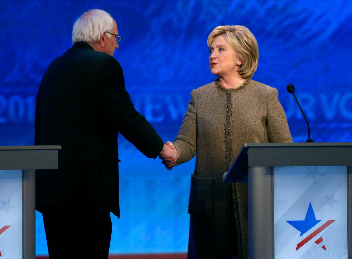 Bernie Sanders, left, speaks to Hillary Clinton after a Democratic presidential primary debate Saturday, Dec. 19, 2015, at Saint Anselm College in Manchester, N.H. (AP Photo/Jim Cole) (AP)