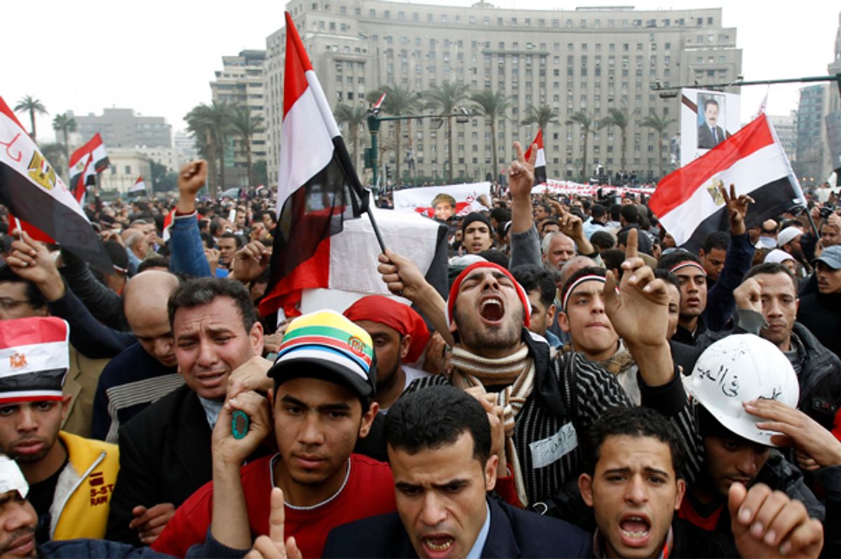 Egyptian anti-government demonstrators hold a symbolic funeral for journalist Ahmed Mohammed Mahmoud, killed during clashes with pro-government supporters at Tahrir Square in Cairo February 7, 2011.   (Reuters/Amr Dalsh)