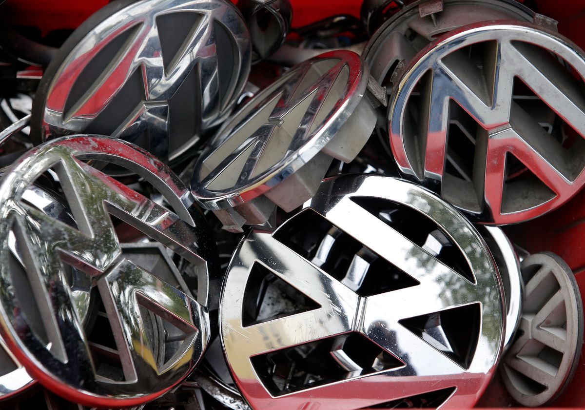 FILE - In this Sept. 23, 2015 file photo Volkswagen ornaments sit in a box in a scrap yard in Berlin, Germany. Volkswagen said Wednesday, Dec. 9, 2015 that a problem with carbon dioxide emissions is far smaller than initially suspected, with further checks finding "slight discrepancies" in only a few models and no evidence of illegal changes to fuel consumption and emissions figures. (AP Photo/Michael Sohn, file) (AP)