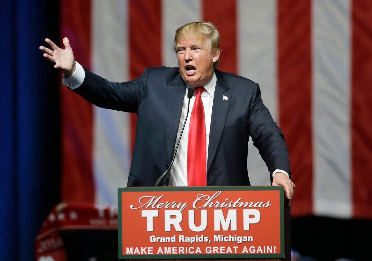 In this photo taken Dec. 21, 2015, Republican presidential candidate, businessman Donald Trump addresses supporters at a campaign rall in Grand Rapids, Mich. The former reality television star and tabloid king has relied on free news coverage to power his presidential campaign. And he wants to control that coverage as much as possible. (AP Photo/Carlos Osorio) (AP)