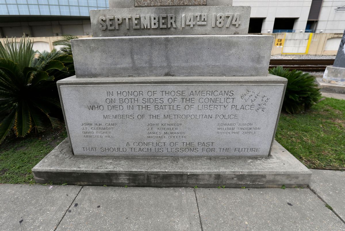 In this Sept. 2, 2015 photo, the inscription on the Liberty Place monument is seen in downtown New Orleans. Prominent Confederate monuments long taken for granted on the streets of this Deep South city may be on the verge of coming down and become new examples of a mood taking hold nationwide to erase racially charged symbolism from public view. Beginning the week of Dec. 7, 2015, the City Council will take up the issue of removing four monuments linked to Confederate history. (AP Photo/Gerald Herbert) (AP)