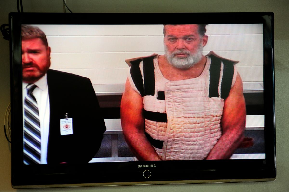 FILE - In this Monday, Nov. 30, 2015, file photo, Colorado Springs shooting suspect, Robert Dear, right, appears via video before Judge Gilbert Martinez,  with public defender Dan King, left, at the El Paso County Criminal Justice Center for this first court appearance, where he was told he faces first degree murder charges in Colorado Springs, Colo. The man accused of killing multiple people at a Planned Parenthood clinic in Colorado asked at least one person in a nearby shopping center for directions to the facility before opening fire, a law enforcement official said. (Daniel Owen/The Gazette via AP, Pool) (AP)