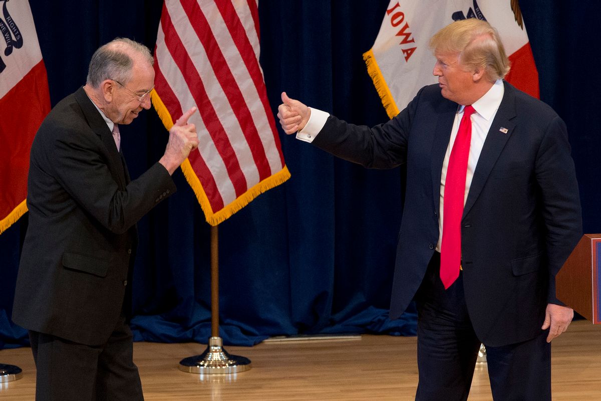 Republican presidential candidate Donald Trump, right, greets Sen. Chuck Grassley, R-Iowa, on stage during a campaign event  (AP)