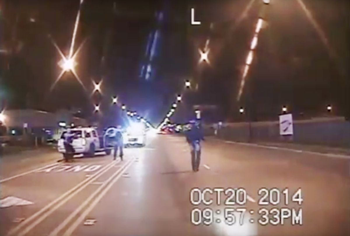 FILE - In this Oct. 20, 2014 frame from dash-cam video provided by the Chicago Police Department, Laquan McDonald, right, walks down the street moments before being shot by officer Jason Van Dyke 16 times in Chicago. (Chicago Police Department via AP, File) (AP)
