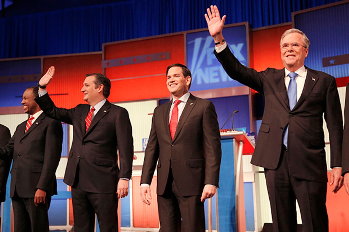 Ben Carson, Ted Cruz, Marco Rubio and Jeb Bush pose together at the start of the Republican debate, January 28, 2015.   (Reuters/Carlos Barria)