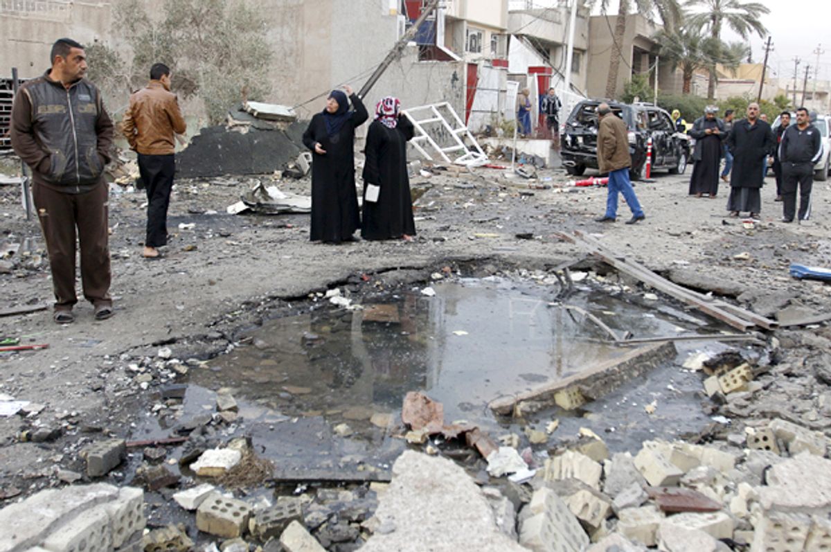Residents gather at the site of a car bomb blast in New Baghdad, Jan. 12, 2016.    (Reuters/Khalid al Mousily)