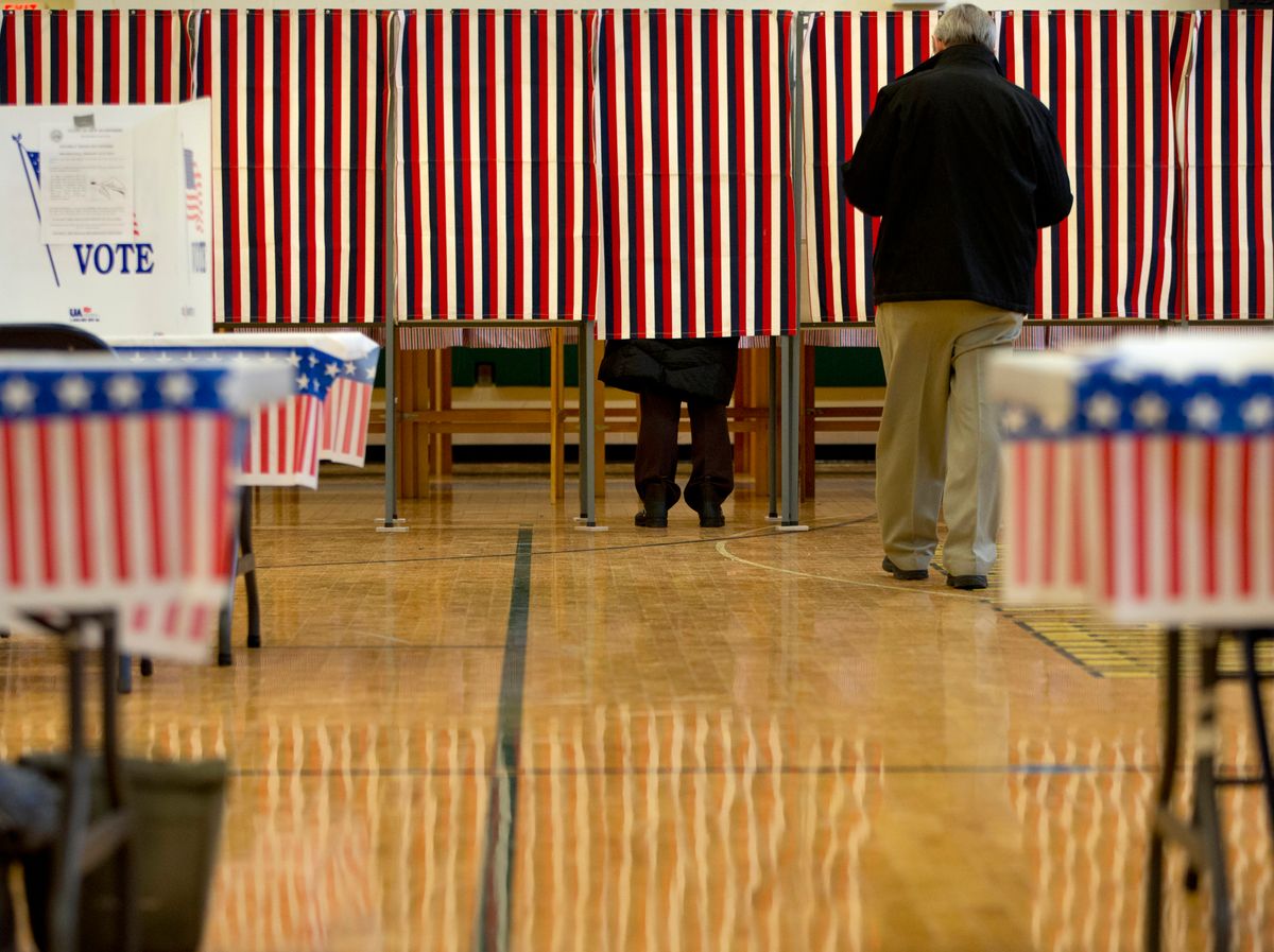 People cast their votes in the presidential primary at Windham High School in Windham, N.H., Tuesday, Feb. 9, 2016, during the New Hampshire primary. (AP Photo/Jacquelyn Martin) (AP)