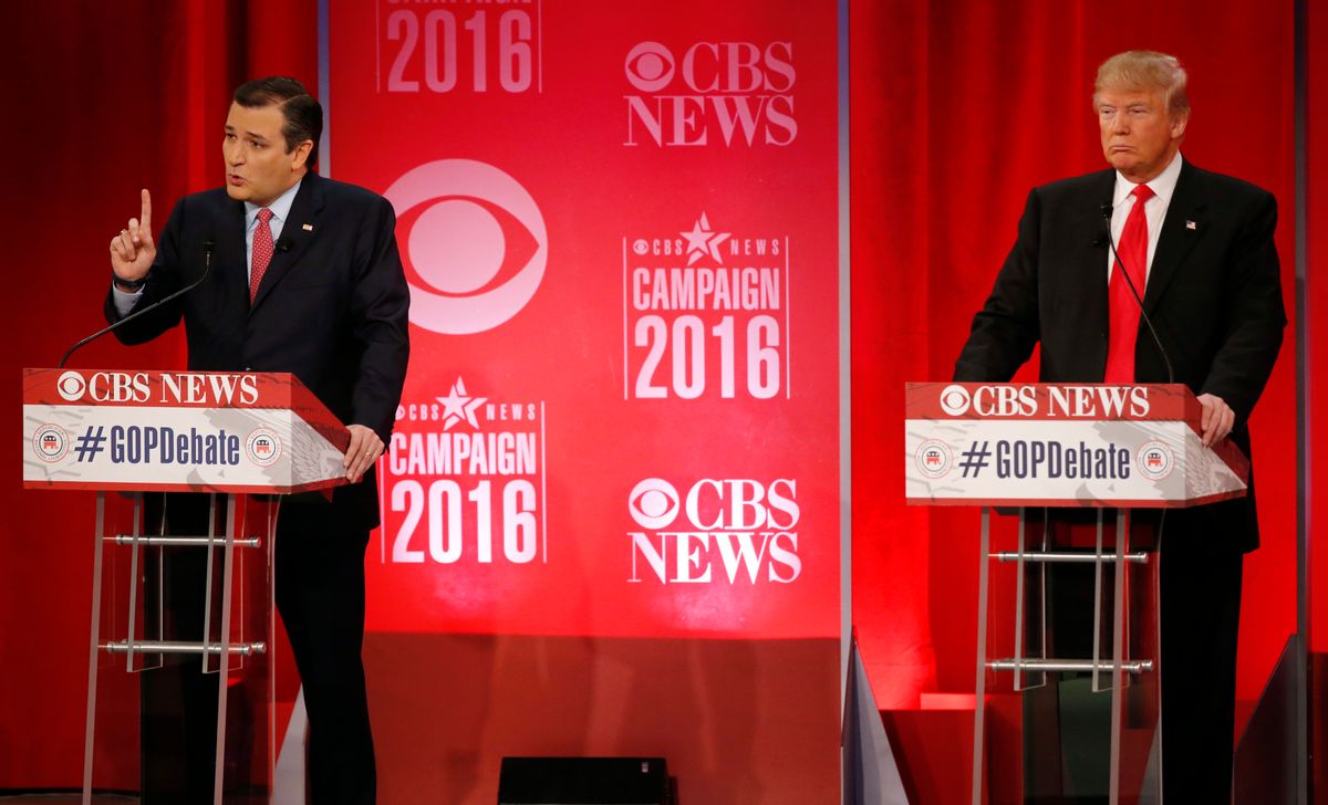 Republican U.S. presidential candidate and U.S. Senator Ted Cruz (L) speaks as businessman Donald Trump listens at the Republican U.S. presidential candidates debate sponsored by CBS News and the Republican National Committee in Greenville, South Carolina February 13, 2016. REUTERS/Jonathan Ernst  - RTX26TMP (Reuters)