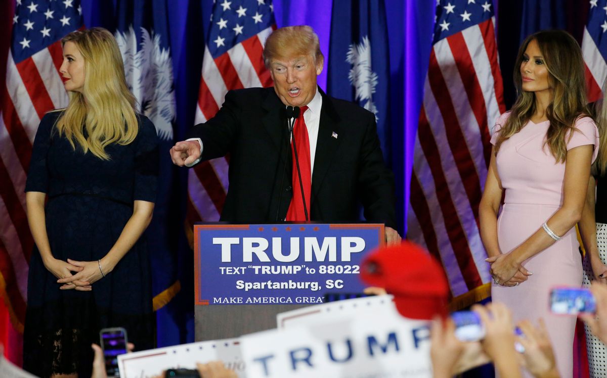 Republican U.S. presidential candidate Donald Trump points into the crowd while accompanied by his daughter Ivanka (L) and his wife Melania (R) at his 2016 South Carolina presidential primary night victory rally in Spartanburg, South Carolina February 20, 2016. REUTERS/Jonathan Ernst  - RTX27V8Q (Reuters)
